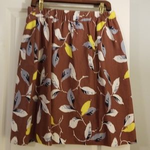 Floral mini skirt with a cream lining.